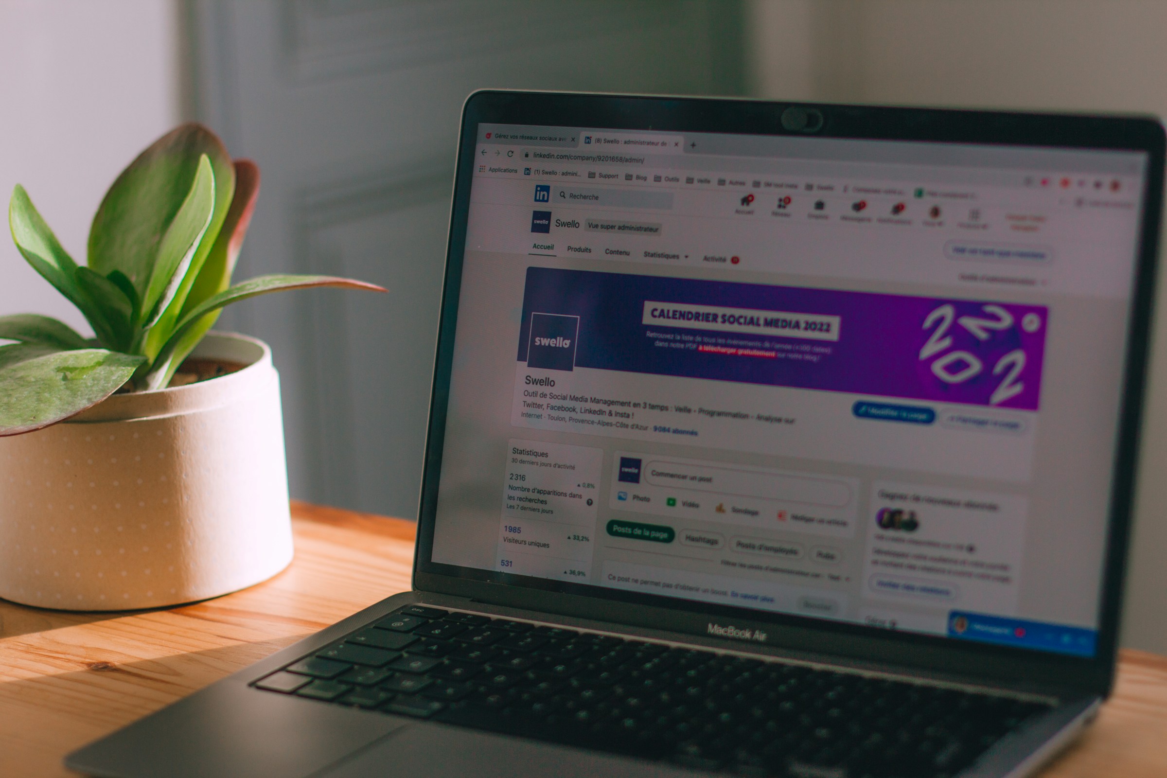 laptop on a table - LinkedIn Tools