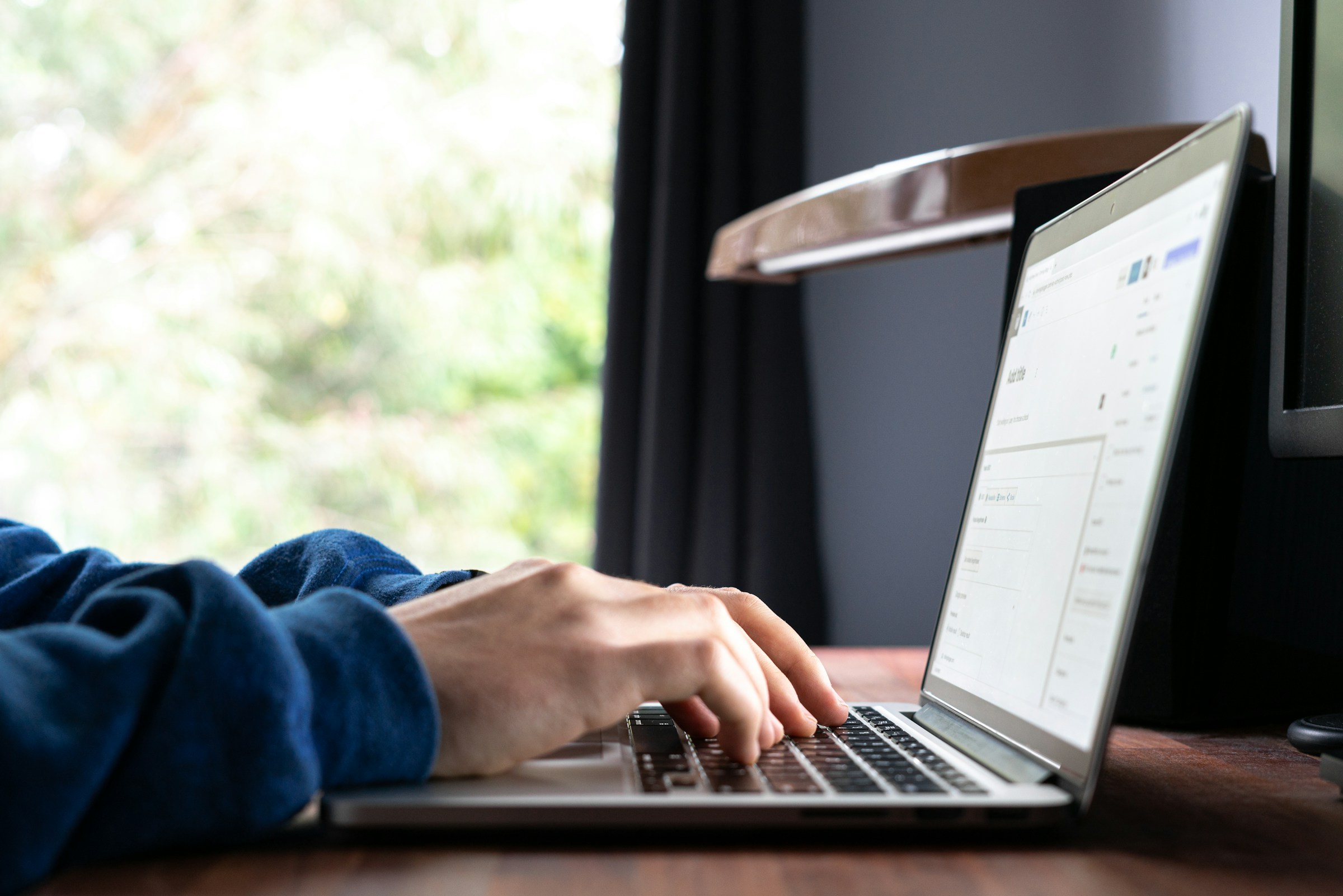 Person typing - How Many Words Should A LinkedIn Post Be