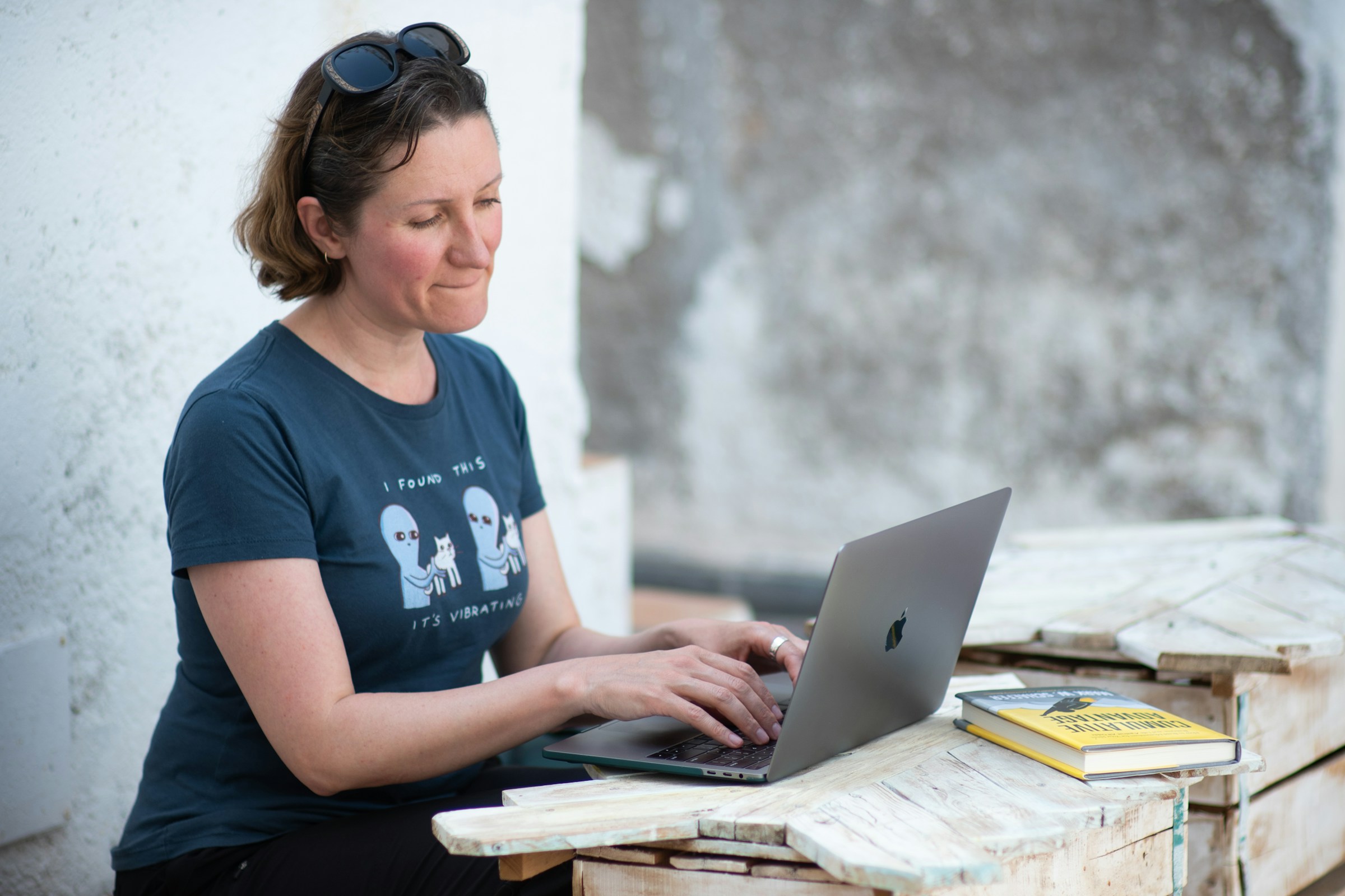 woman on a laptop - Taplio Alternatives