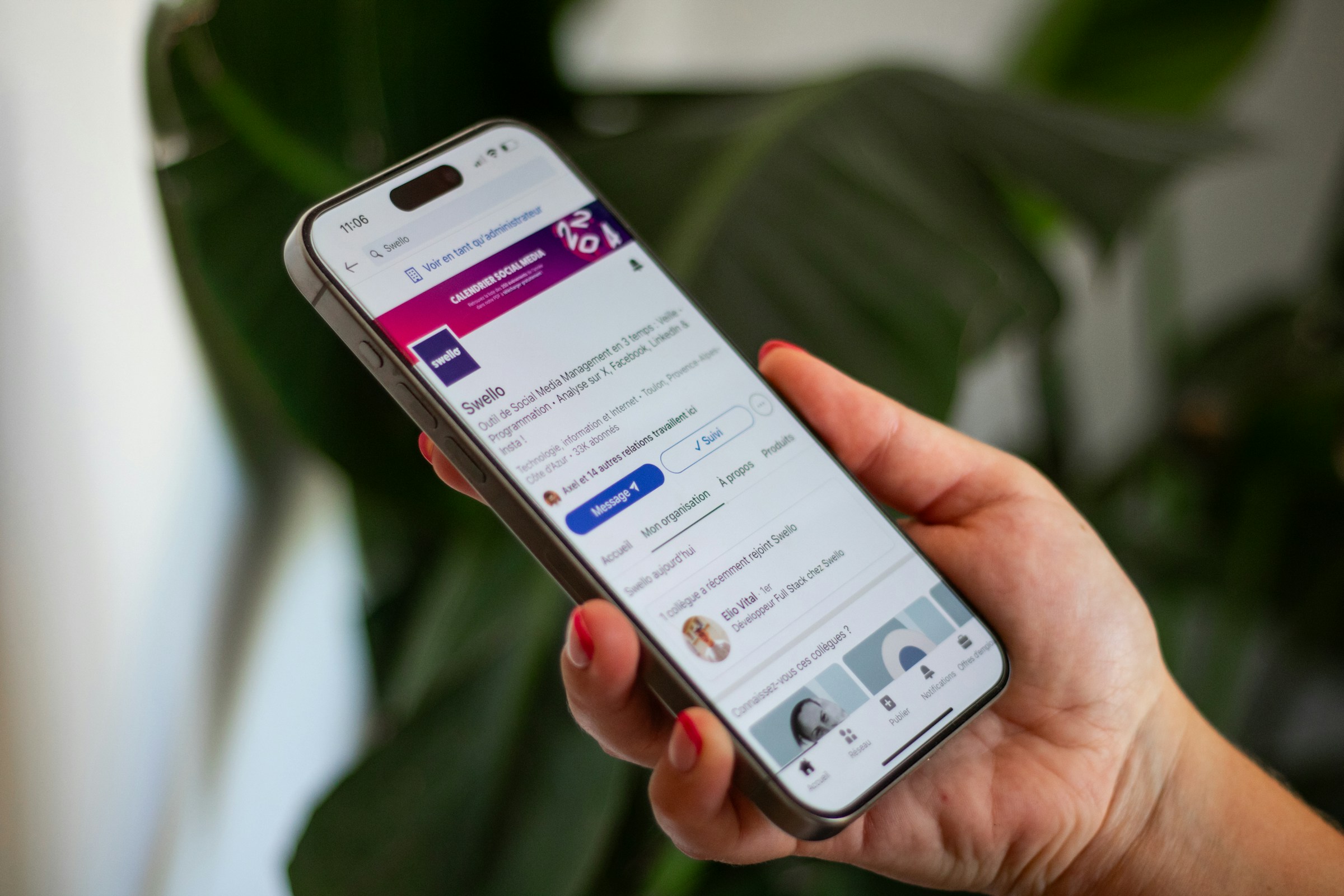 woman holding an iphone - LinkedIn Post Examples