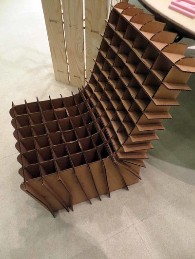 Wooden shelving unit with multiple square compartments arranged in a curved architectural structure