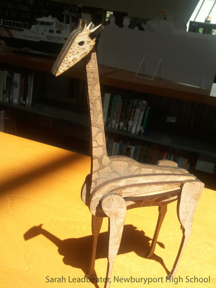 Wooden giraffe sculpture with intricate carved patterns on yellow surface indoors