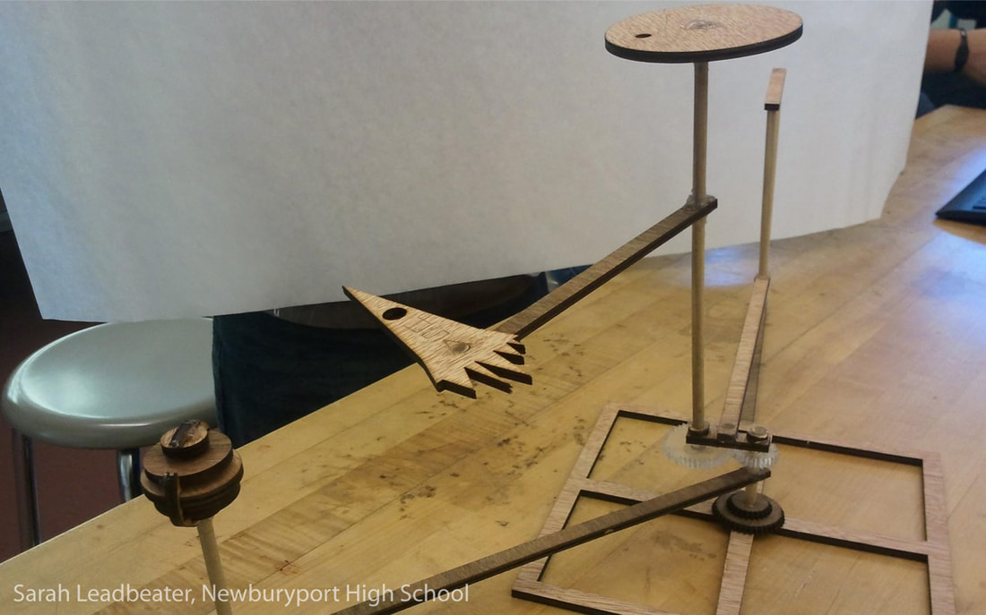 Wooden sculptural piece featuring carved hand, circular platform, and vertical elements on display