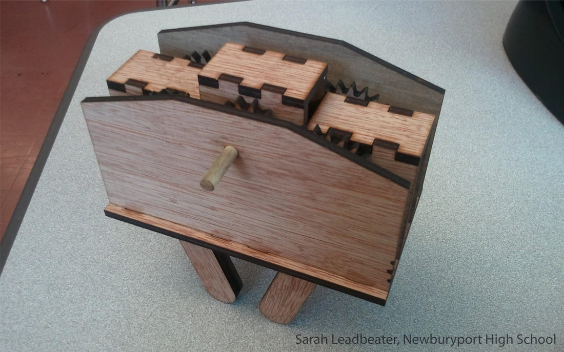 Wooden jewelry box with jagged castle-like lid design and wooden handle.