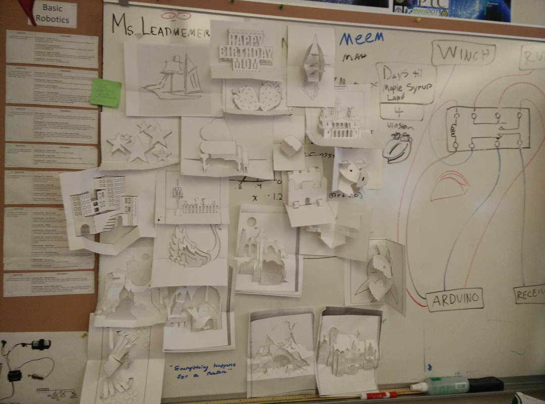 Student project board with sketches, diagrams, notes about robotics and Arduino