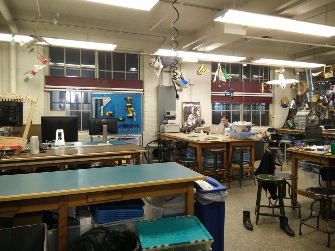 MIT Edgerton Center makerspace: seating layout where tables jut out from the wall to create more seating and fewer places for "junk" to collect.