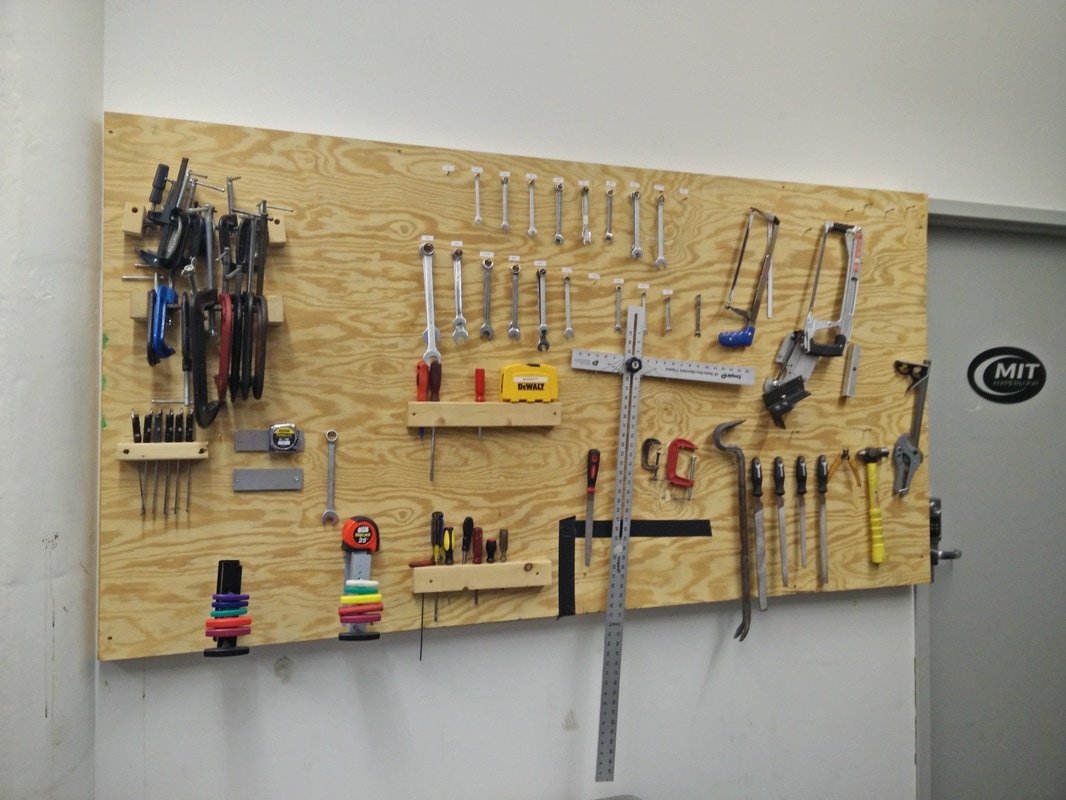 Custom tool storage wall - who needs pegboard when you have plywood?