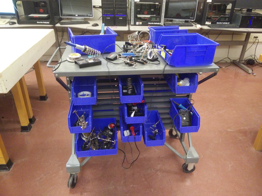 Electronics bench with storage