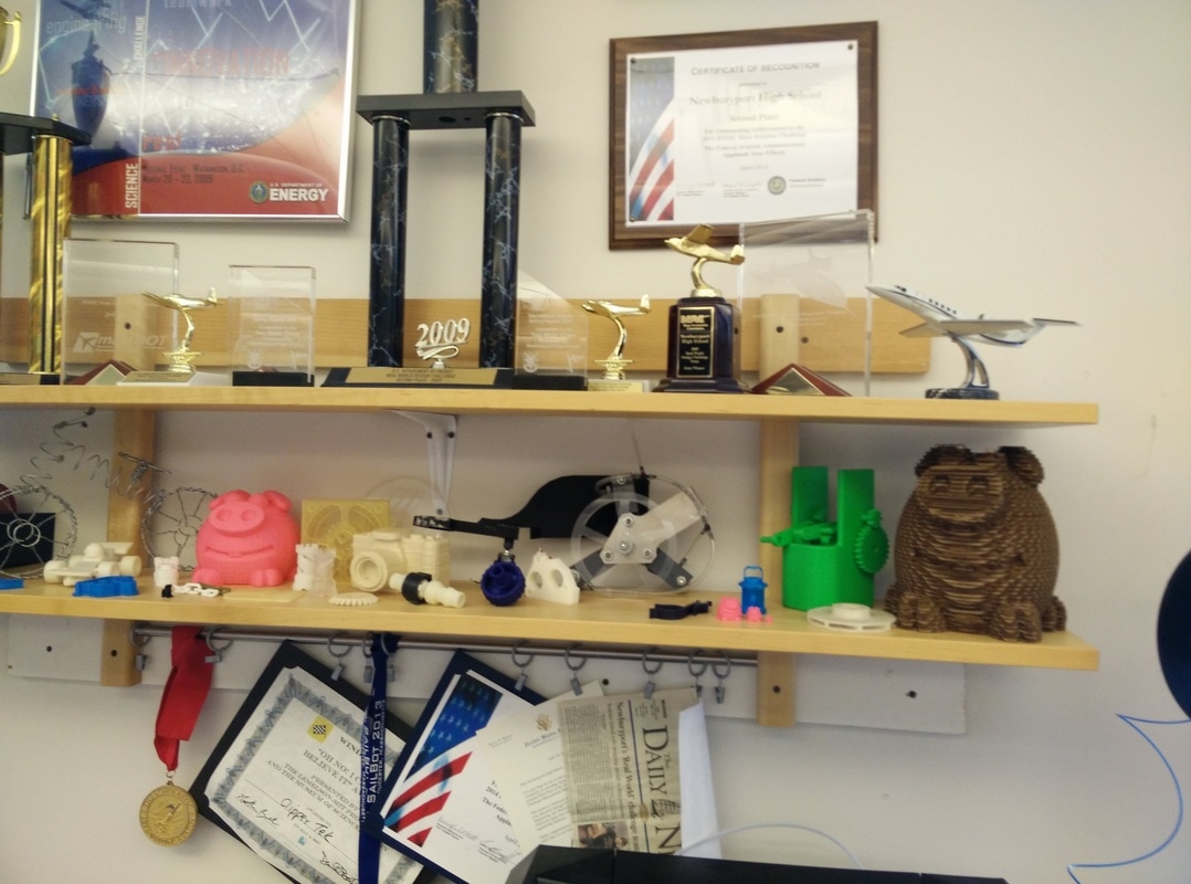 Some projects displayed on a shelf.