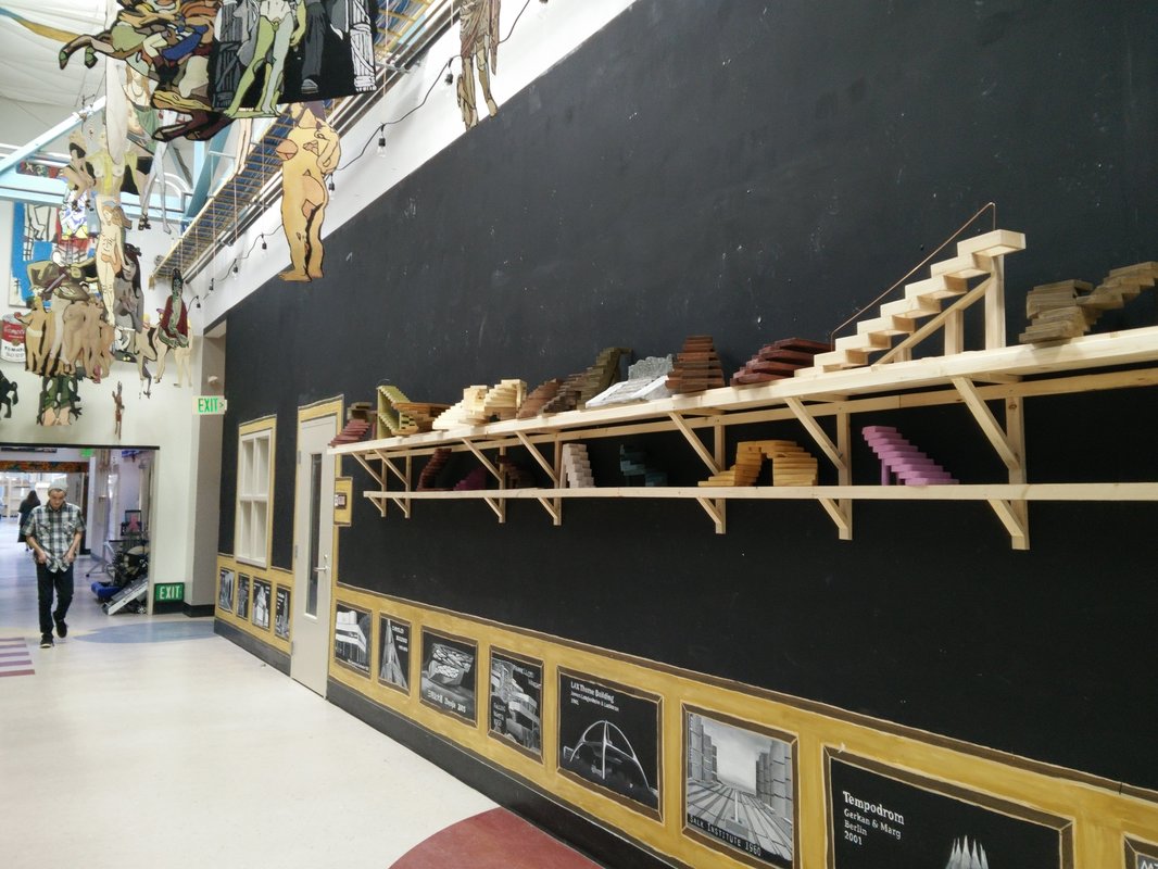 If you're out of shelf space, wall or ceiling hanging displays can be a useful hack.