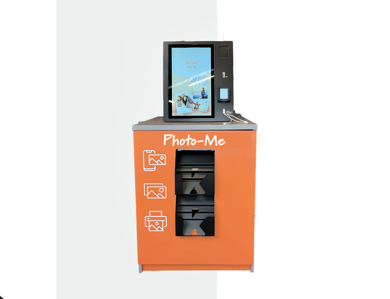 Orange Photo-Me print kiosk with a touchscreen displaying photo format 10x15 and slots for printing photos.