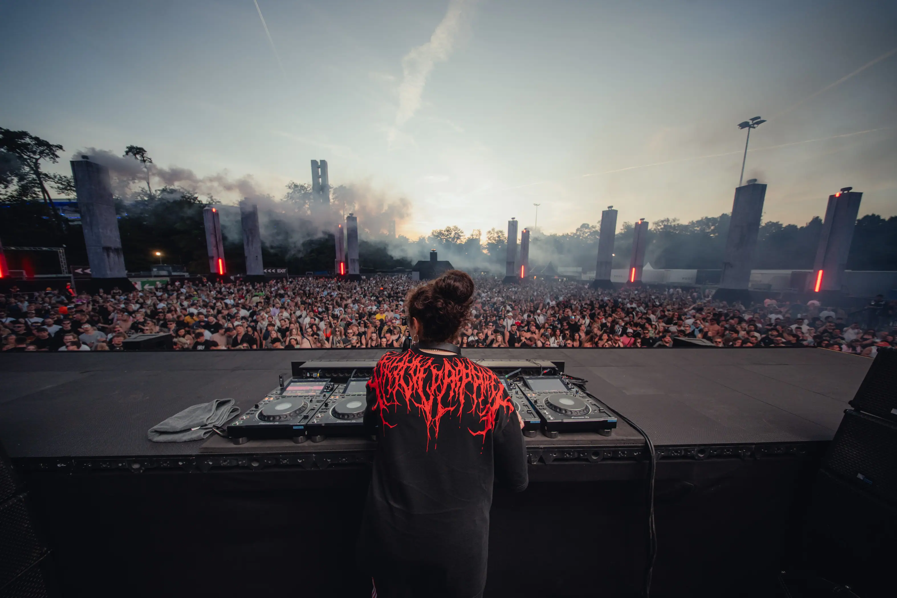 Dj performing at large outdoor music.