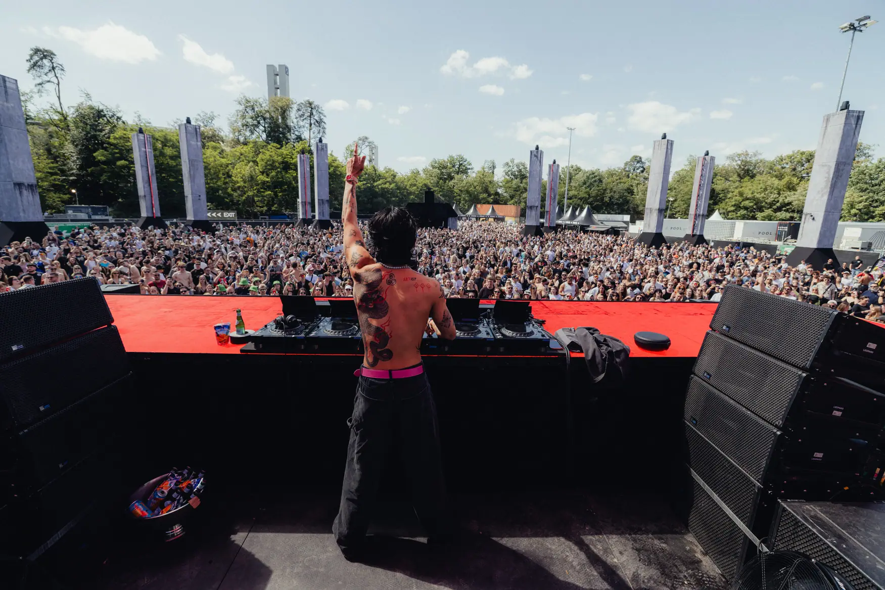 Dj performing at outdoor concert.