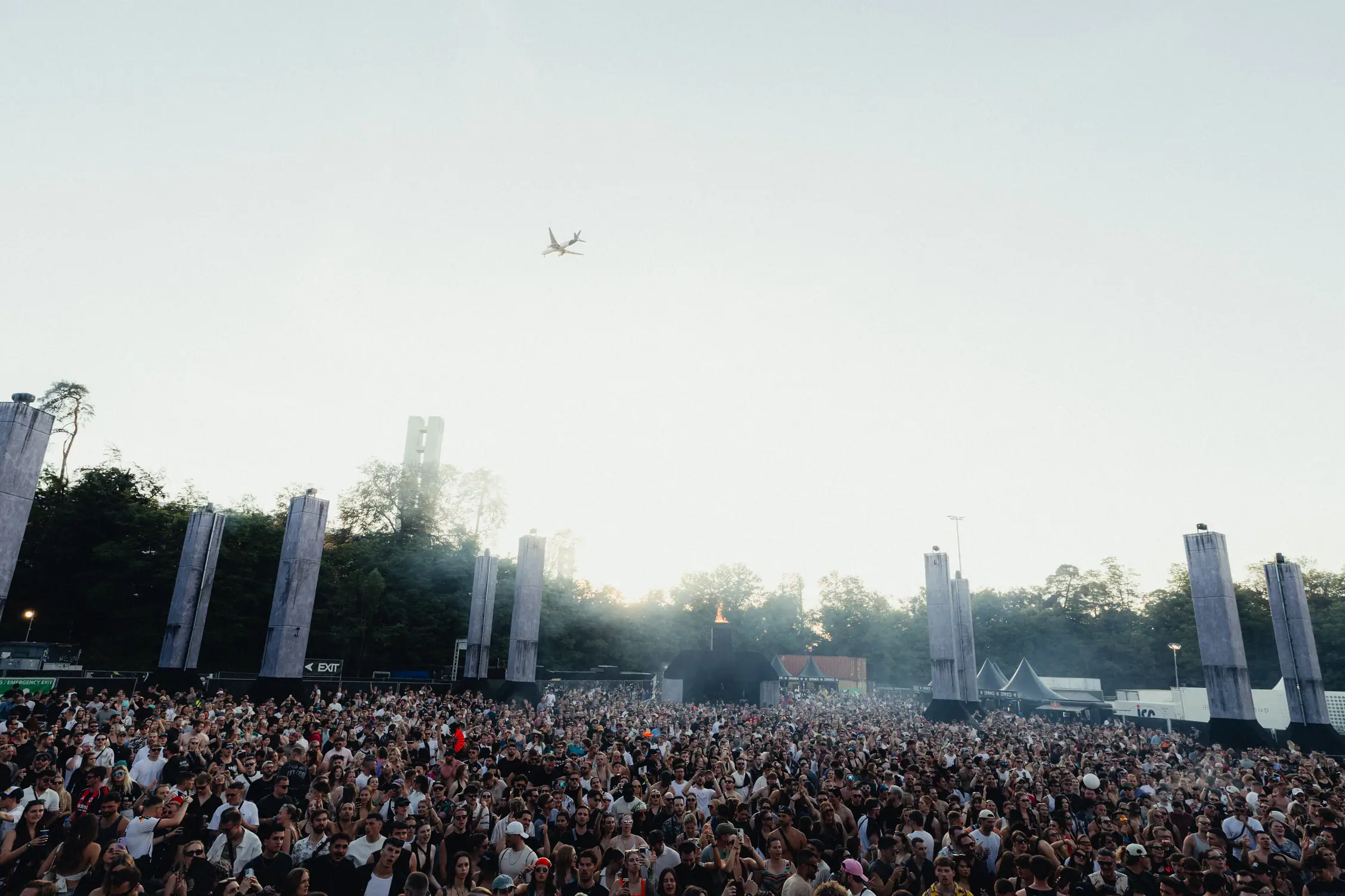 Large crowd at outdoor music festival.