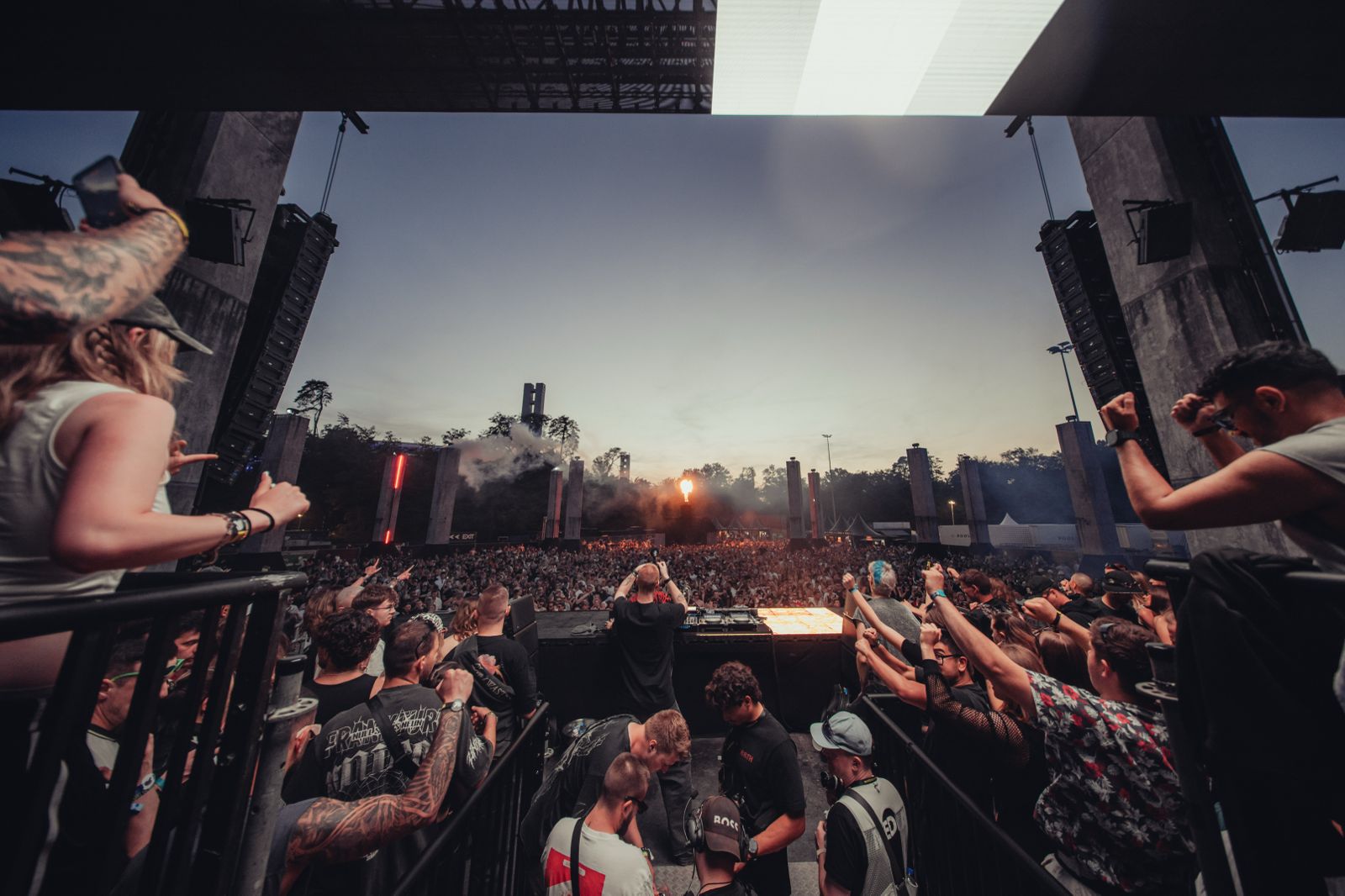 Large crowd at outdoor music festival.