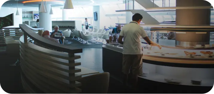 Free Zone In Dubai with modern workspace and employees at curved counter