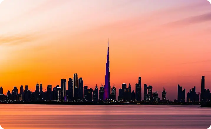 Free Zone In Dubai skyline at sunset with iconic Burj Khalifa silhouette