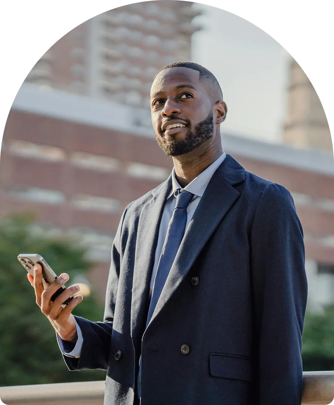 Business professional in Free Zone In Dubai using smartphone with city backdrop