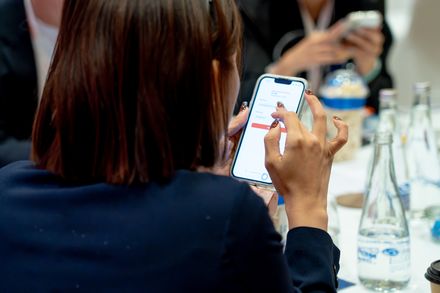 A delegate signing in to the conference platform on her phone.