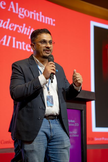 A speaker presenting a session on stage at the Great Place To Work® Conference.