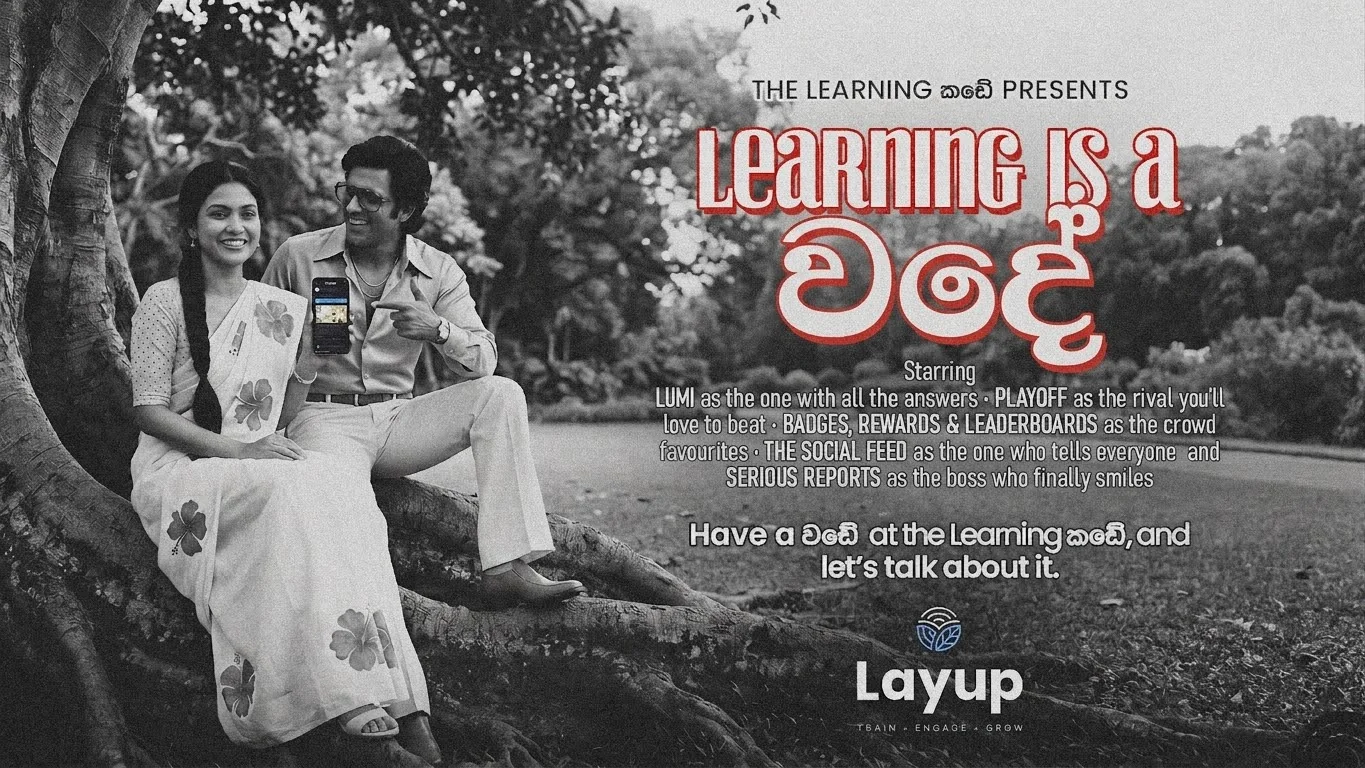 Film poster for Learning is a වදේ: a 1970s-style couple in a garden, one holding a phone showing Layup