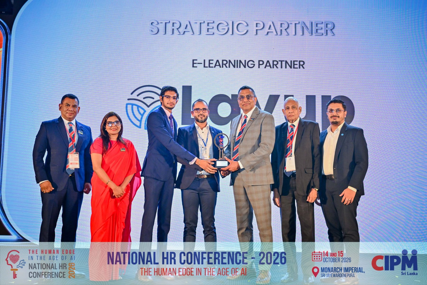 The Layup team on stage receiving the Strategic e-Learning Partner award at NHRC 2026