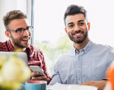 Smiling young professionals in office.