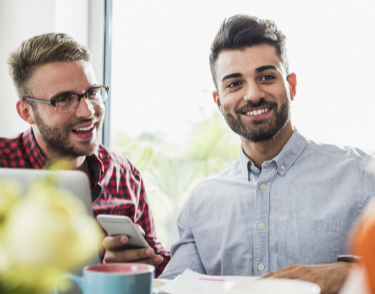 Smiling young professionals in office.