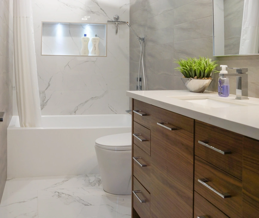Renovated bathroom featuring a freestanding bathtub with a minimalist design