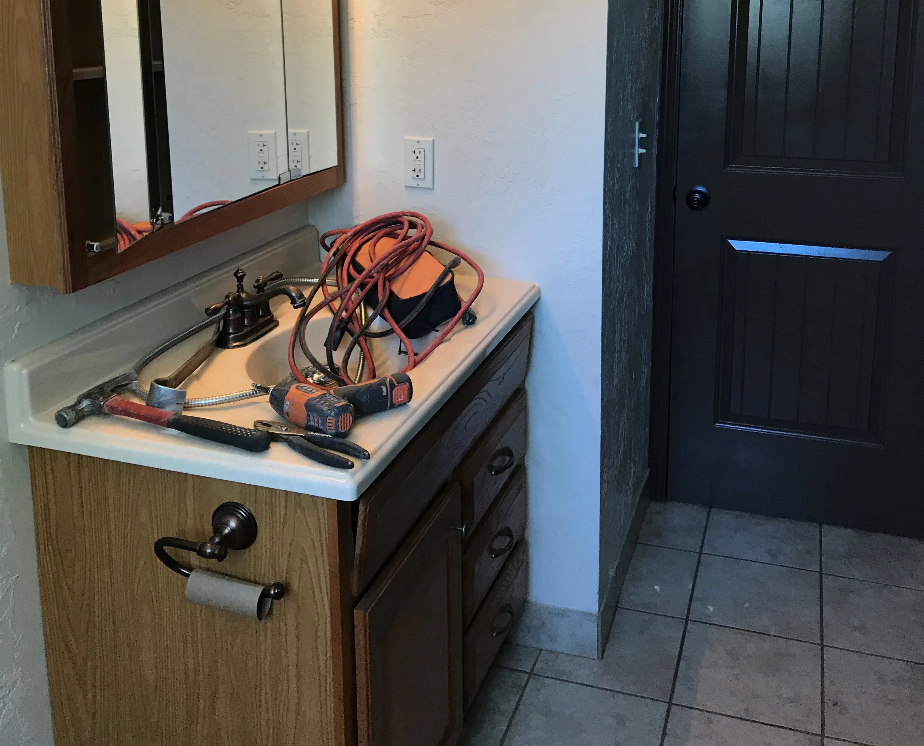 Park City bathroom makeover with floating vanity and matte black fixtures.
