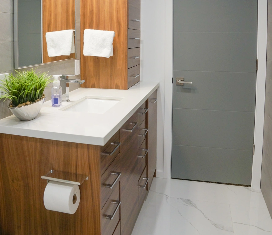 Renovated bathroom in Park City with textured wall tiles and a rain shower head.