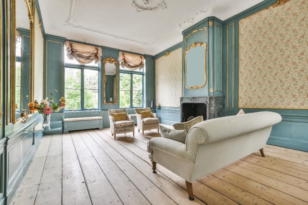An old Salt Lake City home with old hardwood floors and wallpaper walls that needs renovation