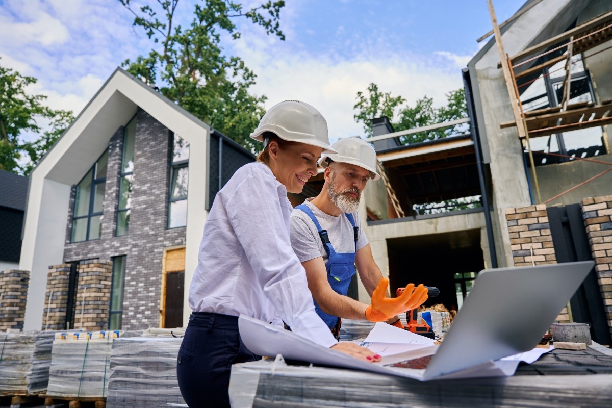 General contractors checking house designs while doing home exterior renovation in Utah