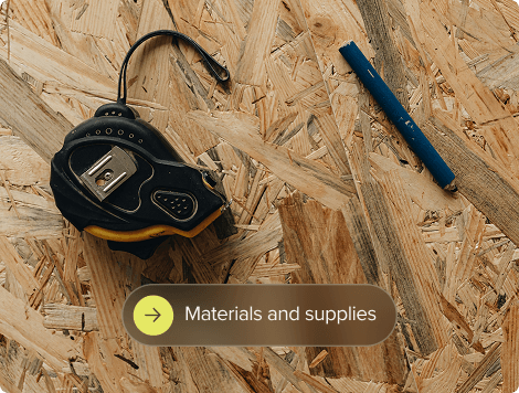 Measuring tape and chalk on plywood.