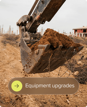 Construction equipment scooping dirt.