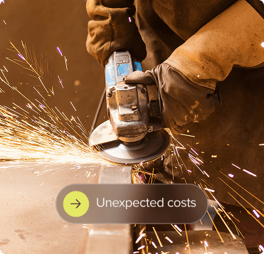 Person holding a sander to a metal frame with unexpected costs overlay.