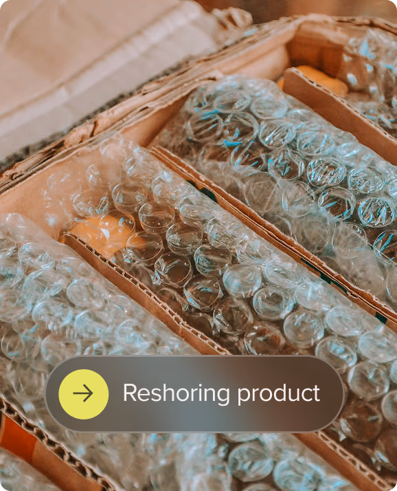 Cardboard box with items wrapped in bubble wrap for protection during shipment.
