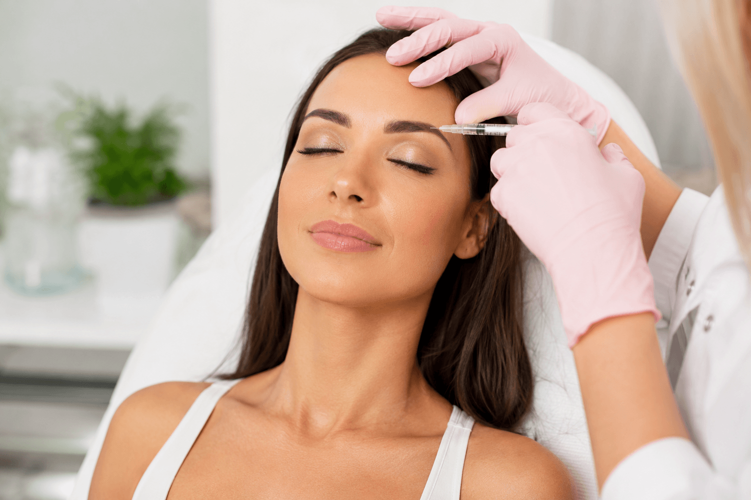 Woman receiving affordable Botox treatment in Tampa, Florida medical spa consultation room