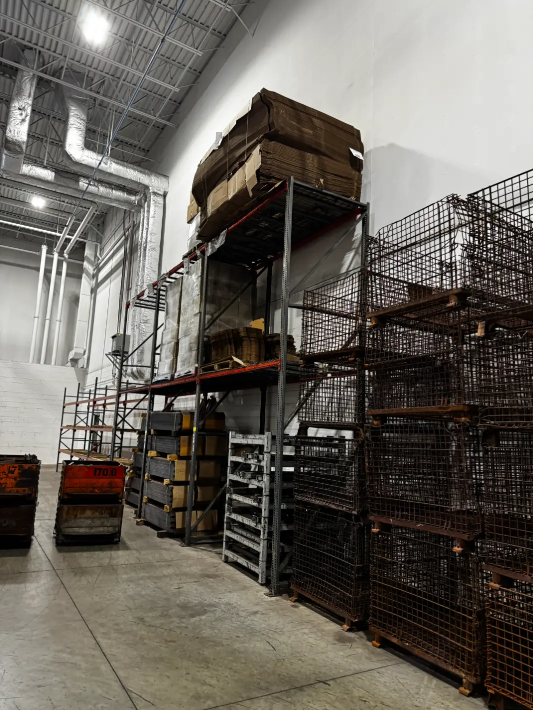 Stackable metal pallets and wire baskets – Rize Home surplus auction, Solon OH