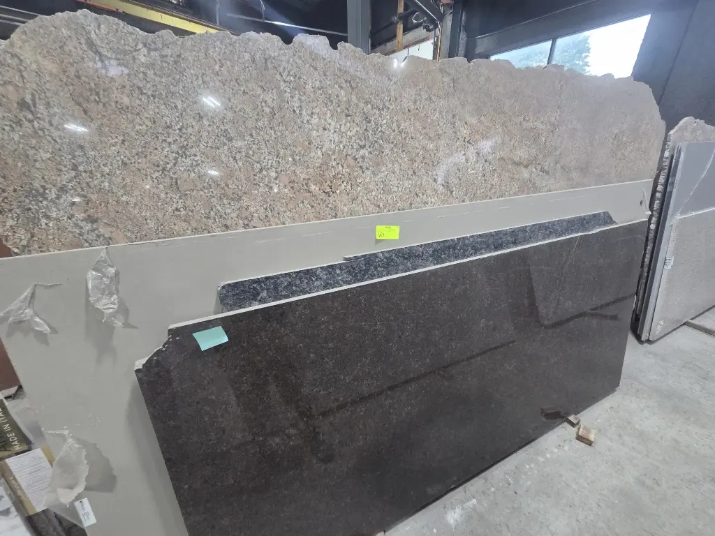 Granite and quartzite slabs on A-frame racks – Stone City Auction, Chicago IL