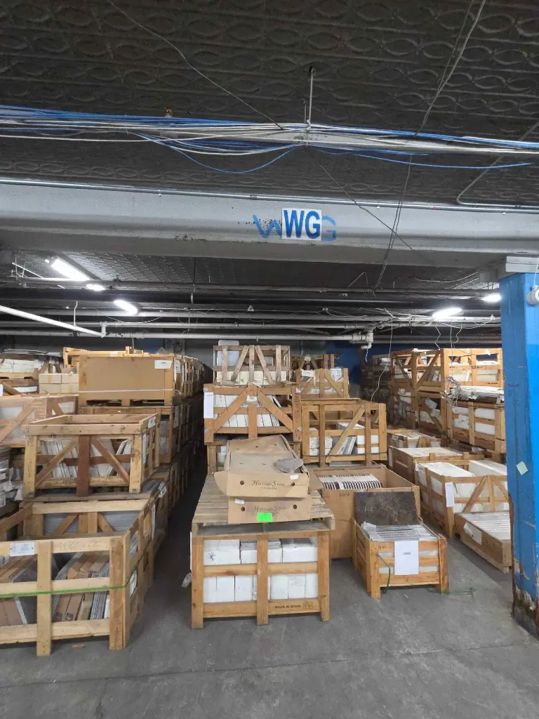 Warehouse overview of crated tile, stone and appliance inventory – Stone City Auction, Chicago IL
