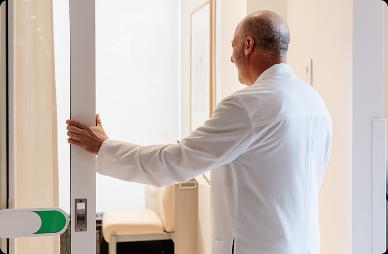 Dr. David Eiley welcoming patient
