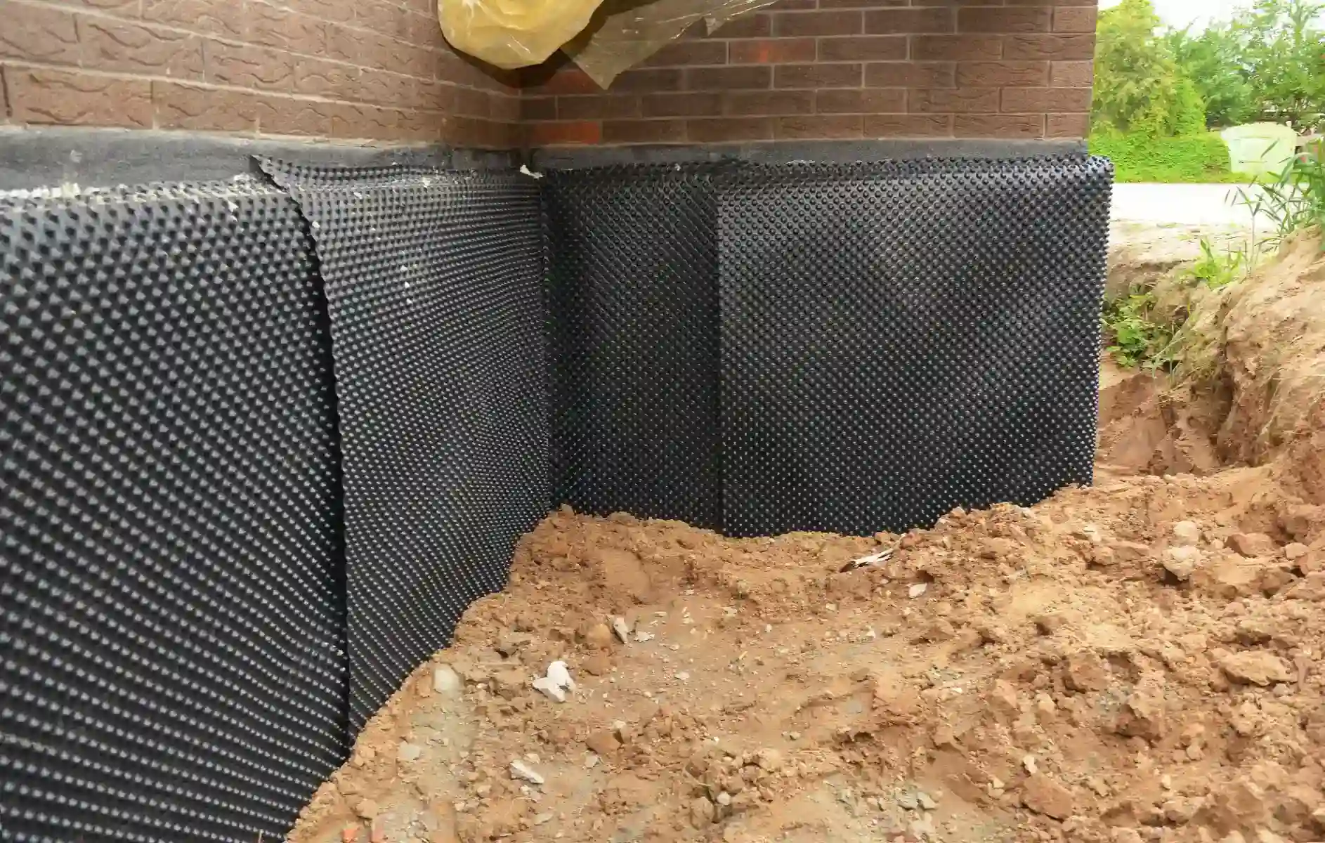 Foundation Foam Insulation Being Applied to Home