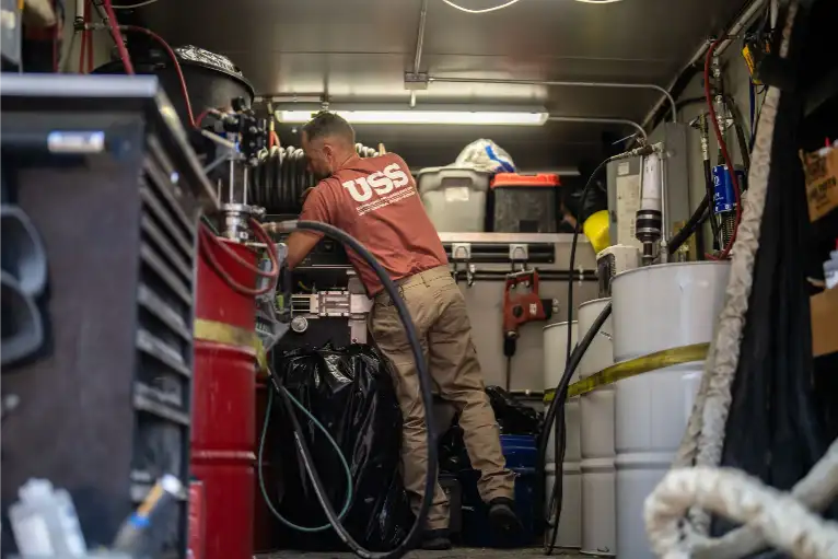 USS Technician Setting Up Foundation Repair Equipment