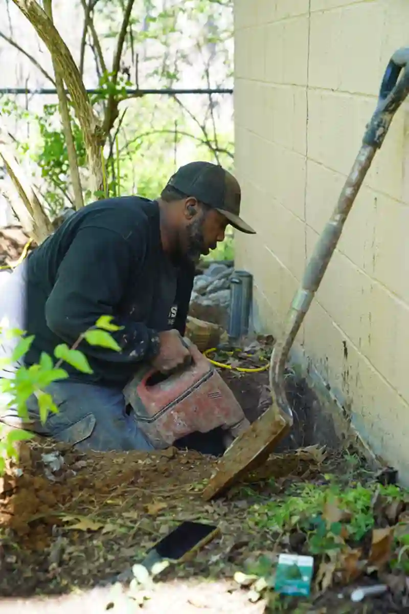 Experienced crew repairing damaged home foundation