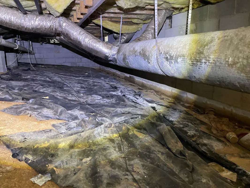USS Tennessee crawl space repair specialists at work
