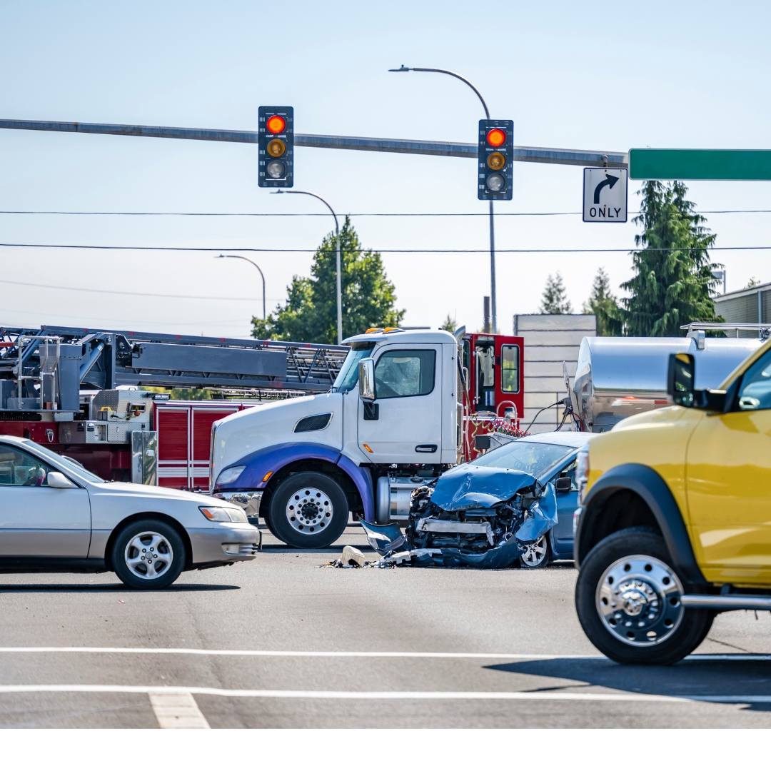 A crash between a car and a tanker truck at an intersection