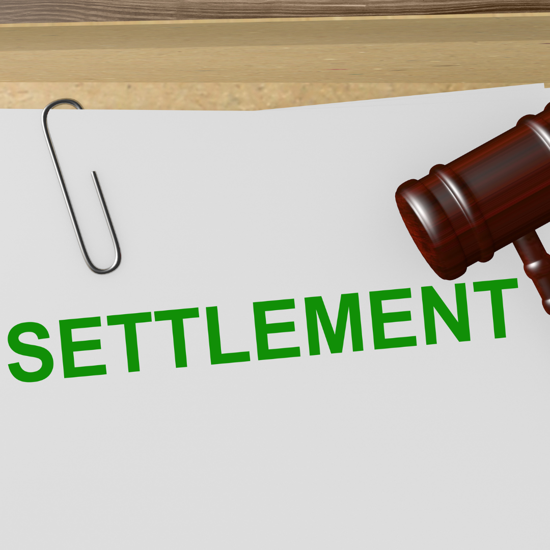 a gavel resting on a document that says "Settlement"