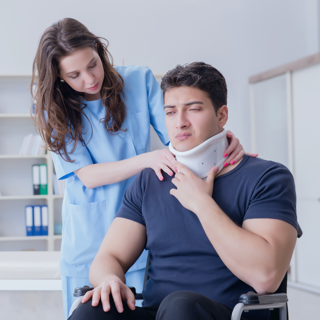An injured man with a neck brace on being attended to by a nurse