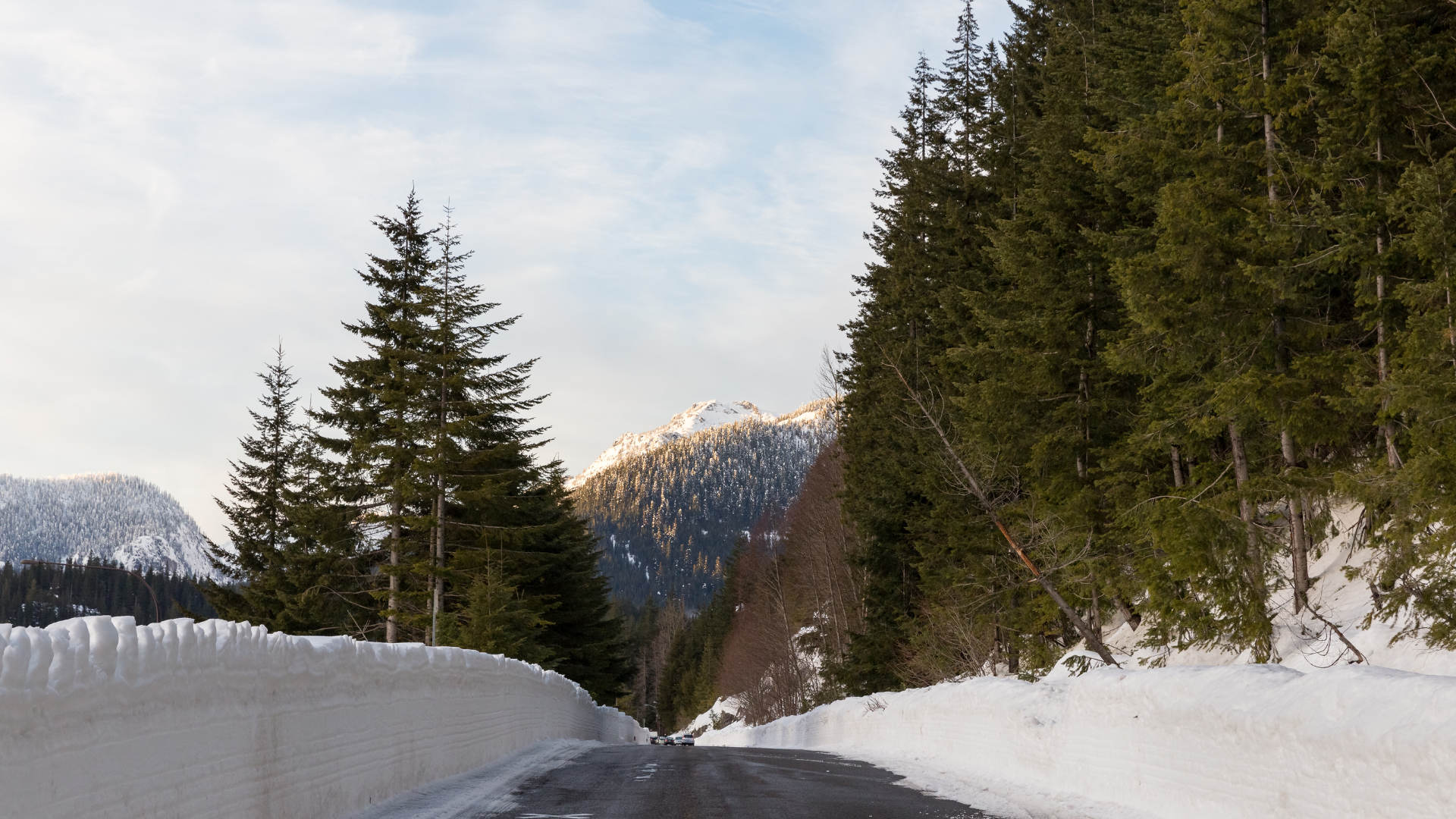Snoqualmie Pass, Washington in the winter with high snowbanks on the side of the road